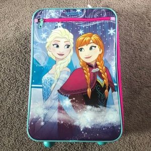 Kids Frozen suit case with wheels.